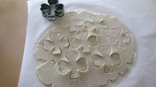cookie dough cut out with Shamrock cookie cutters