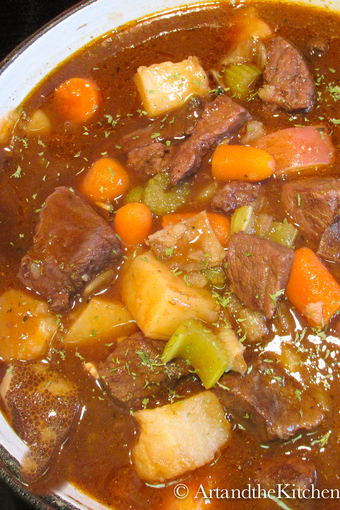 A saucy stew of beef and vegetables in a cast iron pot