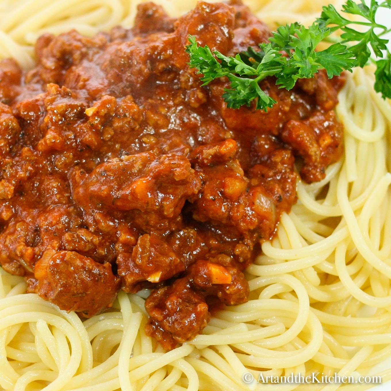 spaghetti pasta topped with a thick meat sauce