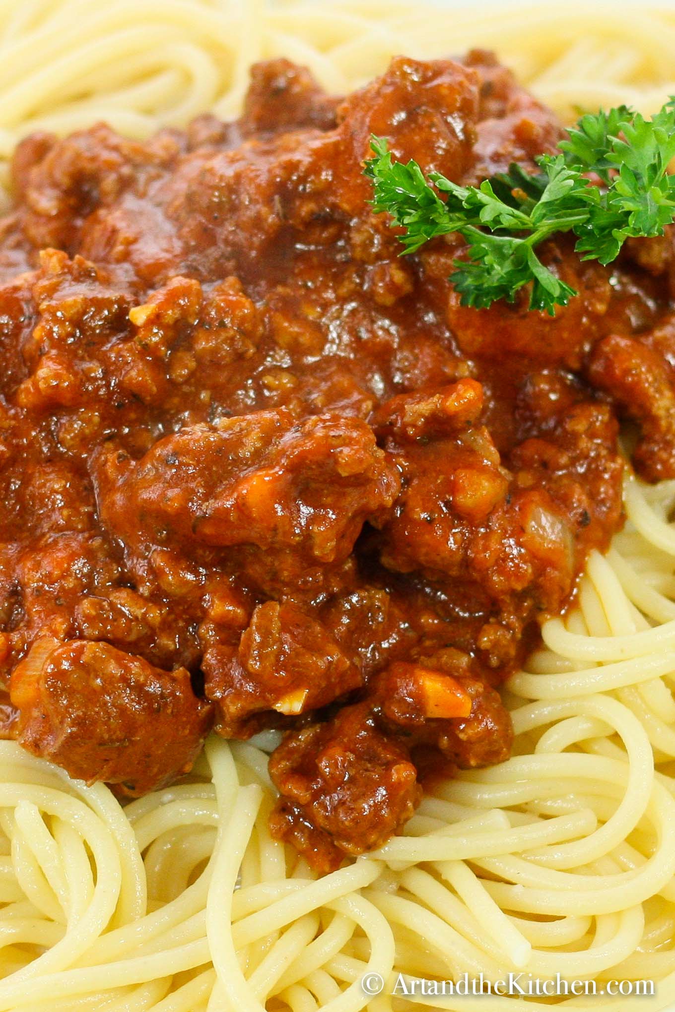 thick meat sauce on top of spaghetti pasta