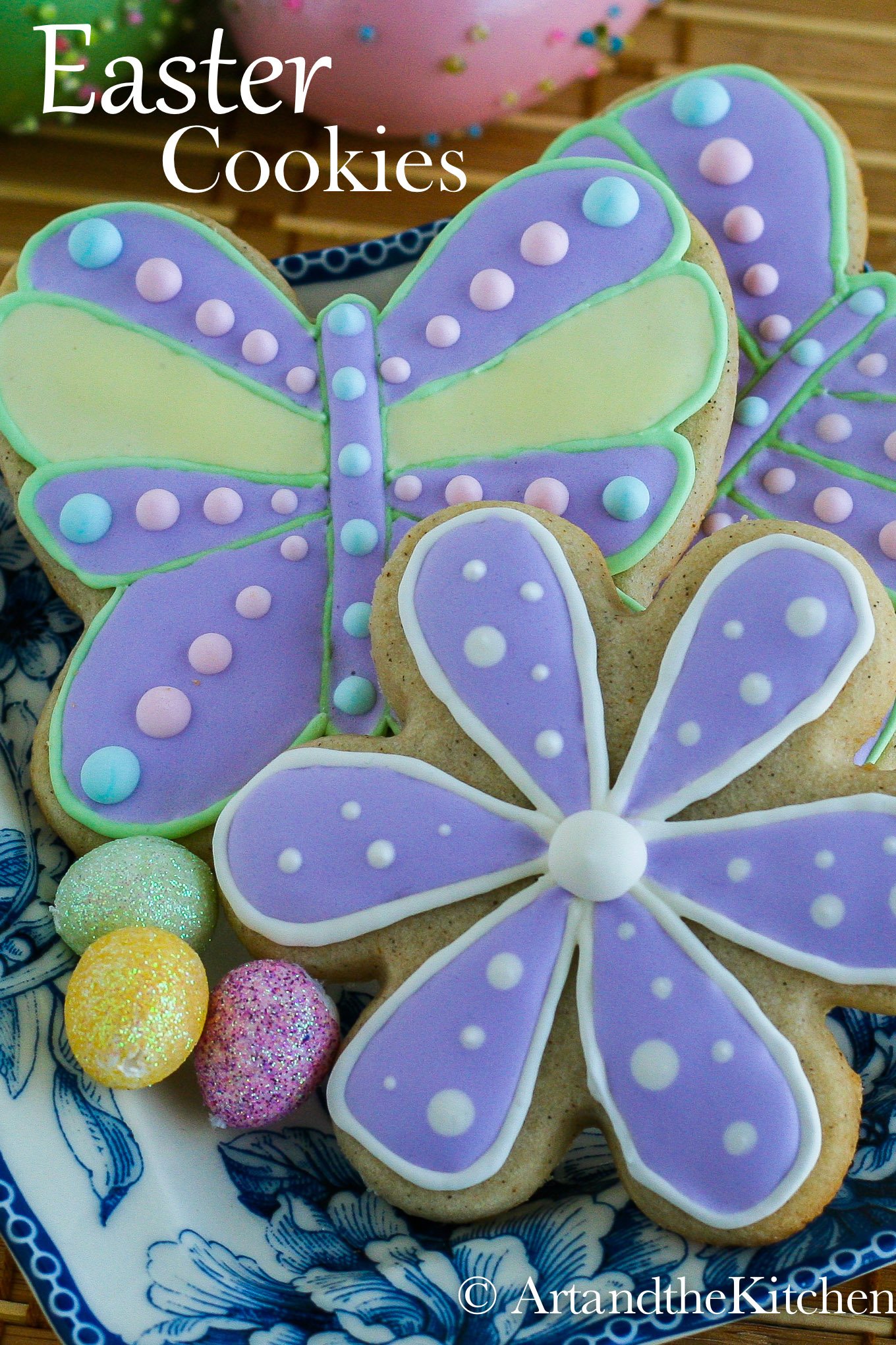 Flower and butterfly shaped sugar cookies decorated with colourful royal icing.