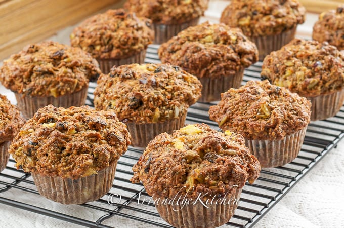 Baking rack with rows of freshly baked muffins.