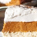 Cream cheese and pumpkin layered pie topped with whipped cream.