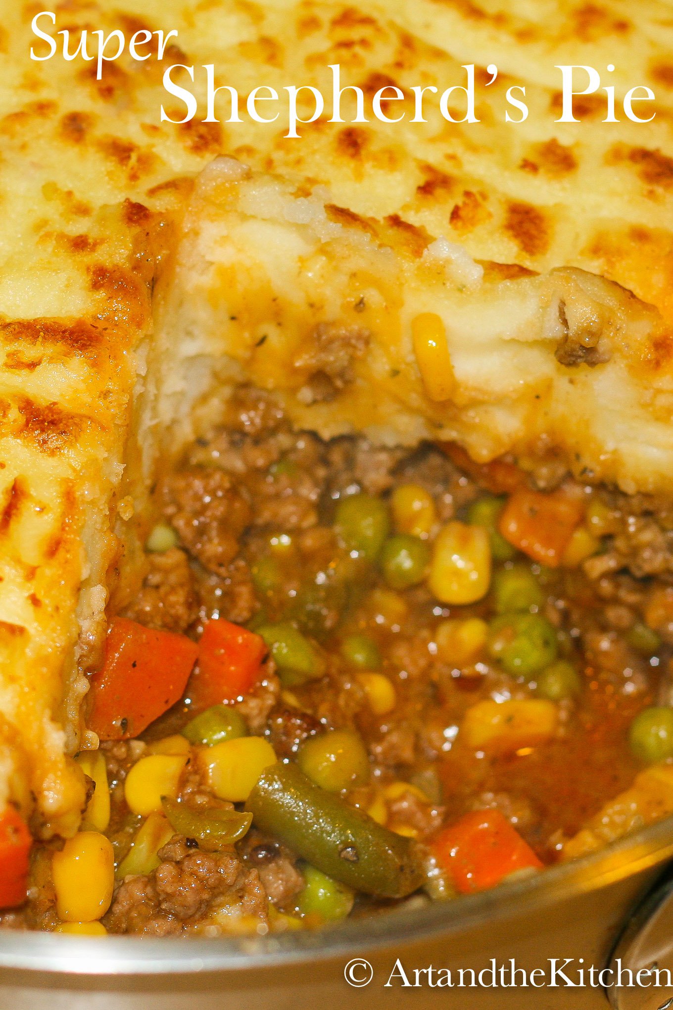 Super Shepherd’s Pie is one of my family’s most requested recipes. This ultimate comfort food recipe has a rich tasty gravy, ground beef, veggies topped with fluffy mashed potatoes. via @artandthekitch