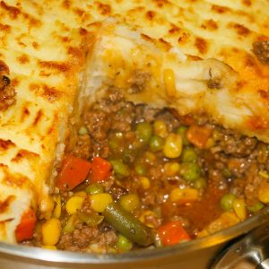 shepherd's pie baked with ground beef, vegetables topped with mashed potatoes.
