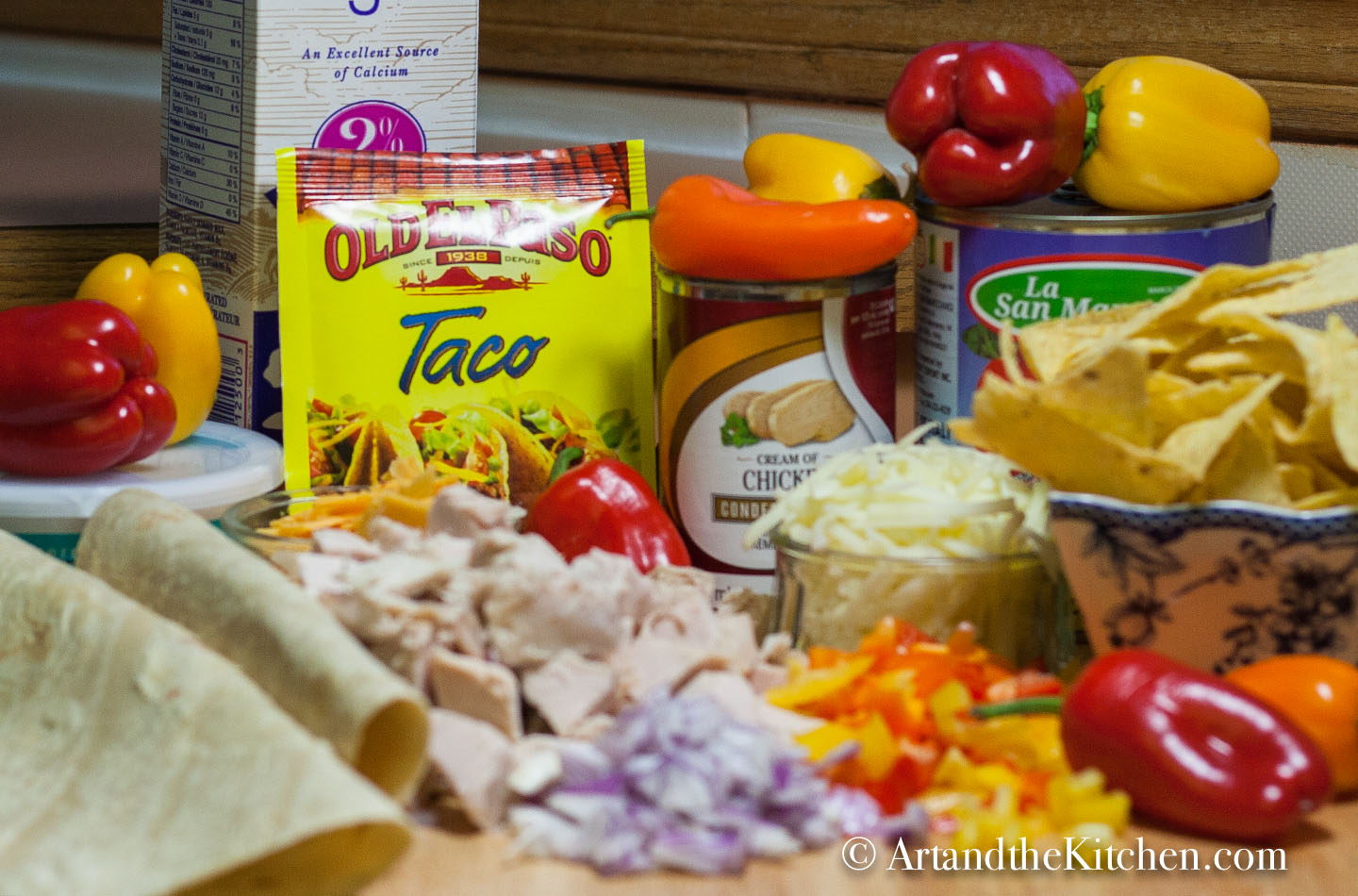 Ingredients for making Mexican turkey casserole. Chopped vegetables, tortillas , spice mix and more.