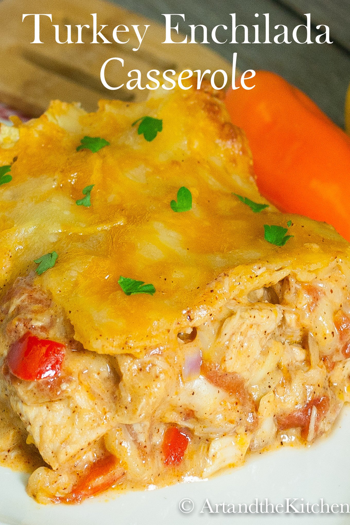 Turkey Enchilada Casserole is a great recipe for using up leftover turkey. All the flavorful spices you use in enchiladas and yummy cheesy layers. via @artandthekitch