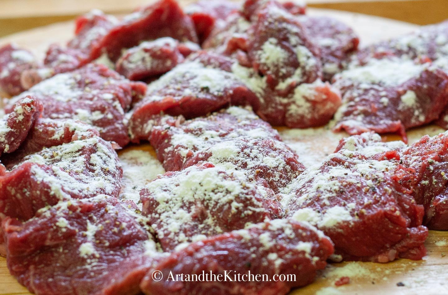 Slices of beef dusted with flour, salt and pepper.