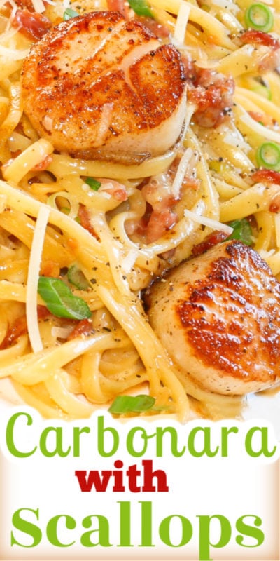 linguine pasta in a creamy carbonara sauce topped with pan seared scallops and green onion slices.
