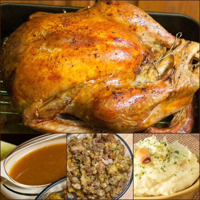 Roast turkey, gravy, bowl of stuffing and mashed potatoes.