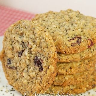 stack of chia, hemp seed oatmeal cookies with one cookie on leaned on side of stack of cookies