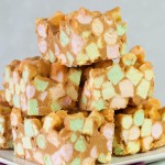 stack of sweet squares made with colorful mini marshmallows, peanut butter and butterscotch chips.