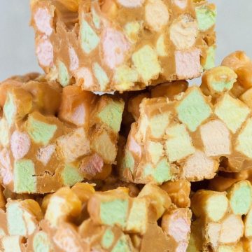Stack of sweet squares made with colorful mini marshmallows, peanut butter and butterscotch chips.