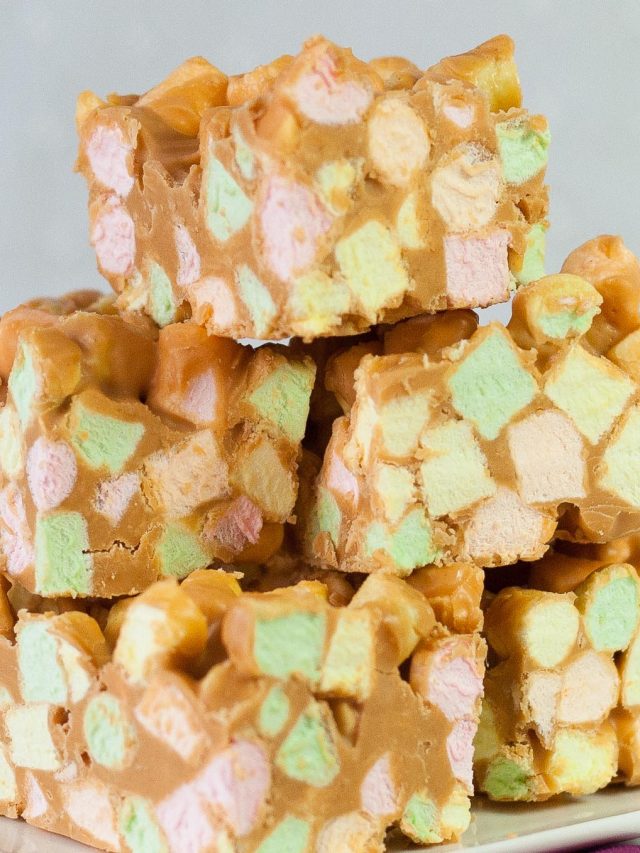 Stack of colorful mini marshmallow squares mixed with peanut butter and butterscotch.