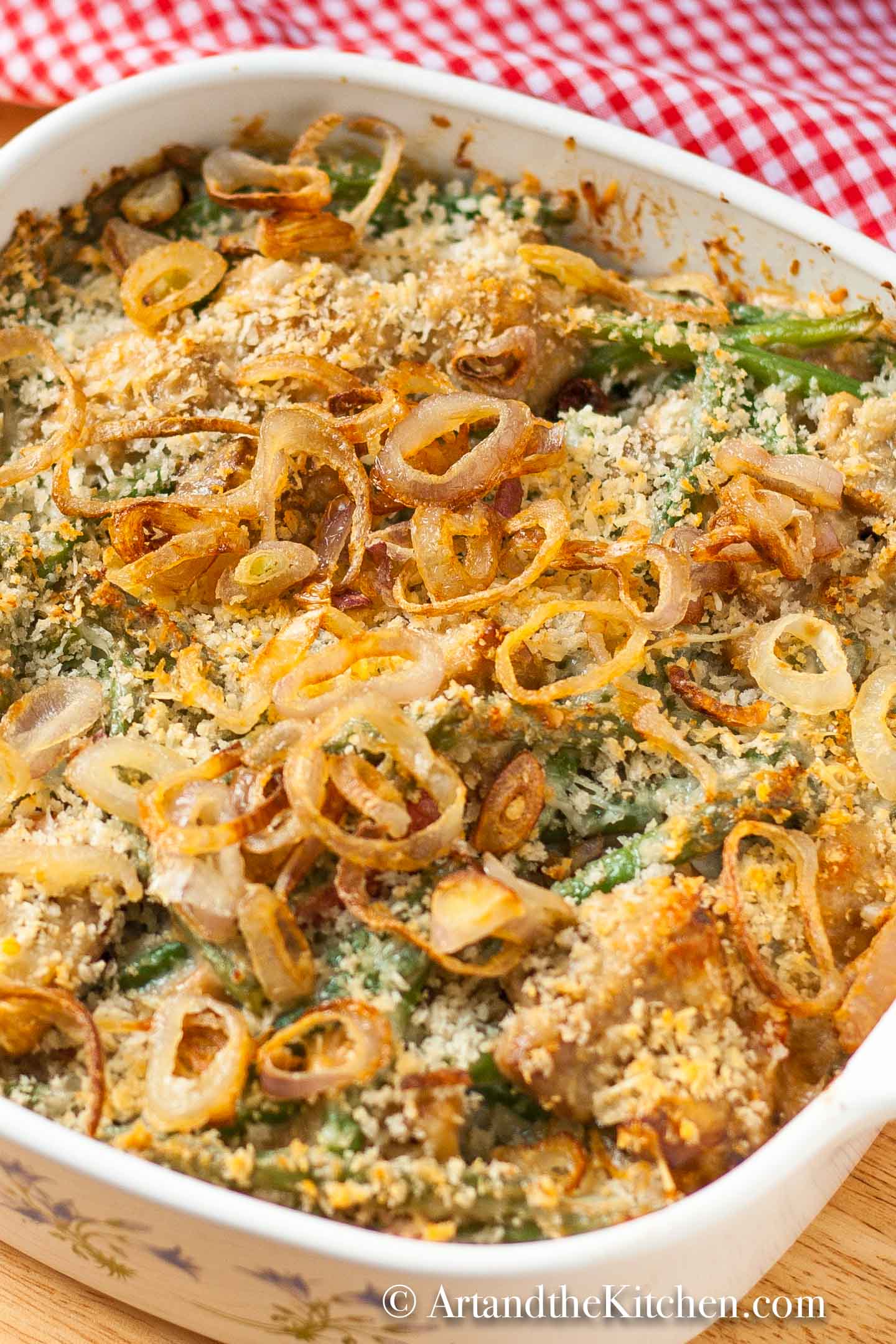 Casserole dish of green beans topped with crispy shallots.