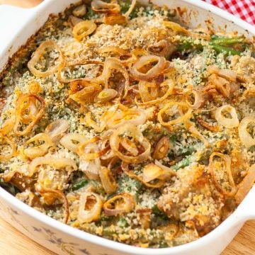 Casserole dish of green beans topped with crispy shallots.
