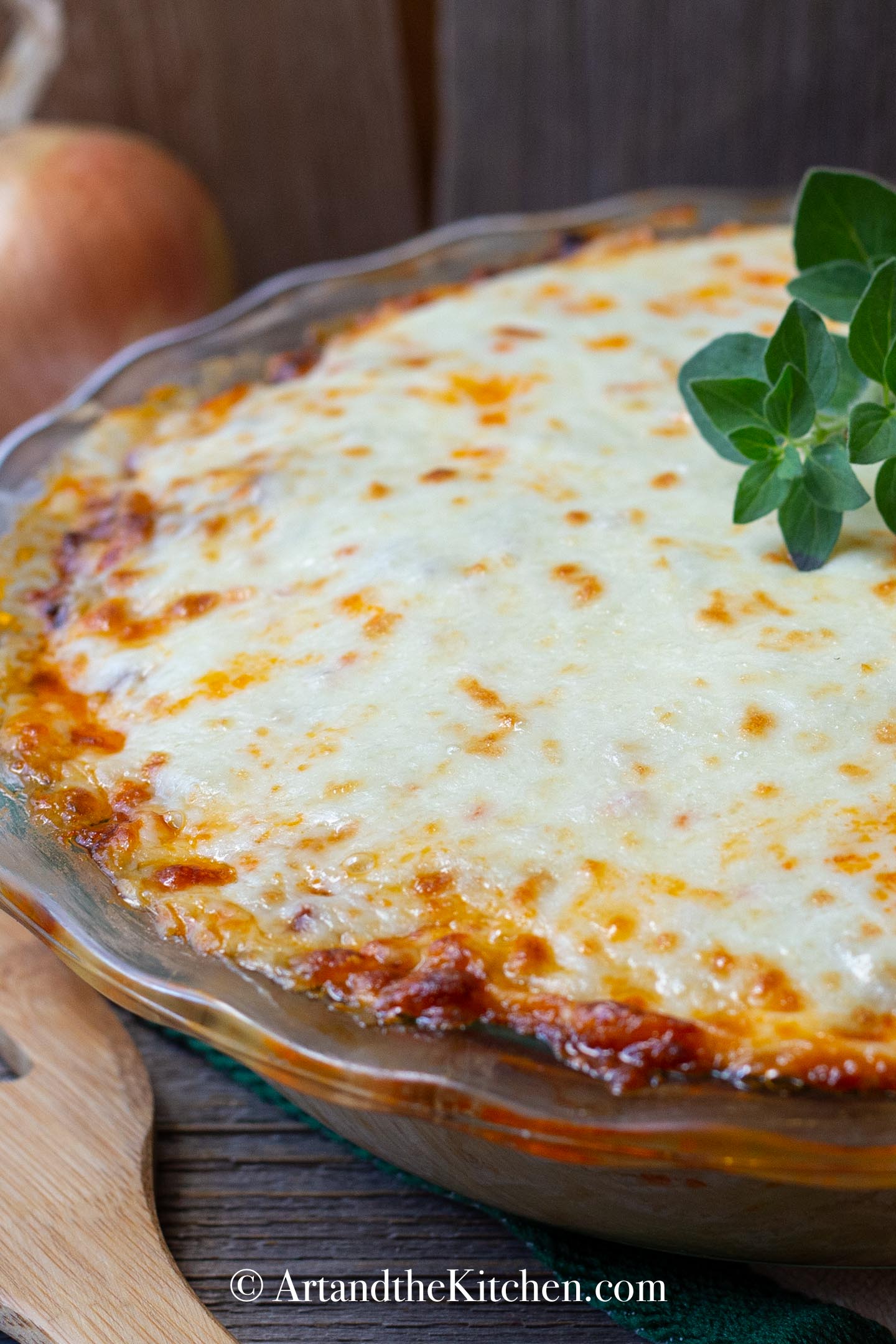 Dinner pie made with spaghetti and meat sauce topped with melted cheese.