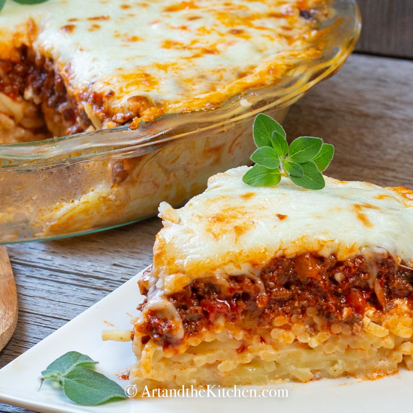 Dinner pie made with layers of spaghetti, meat sauce, topped with melted cheese.