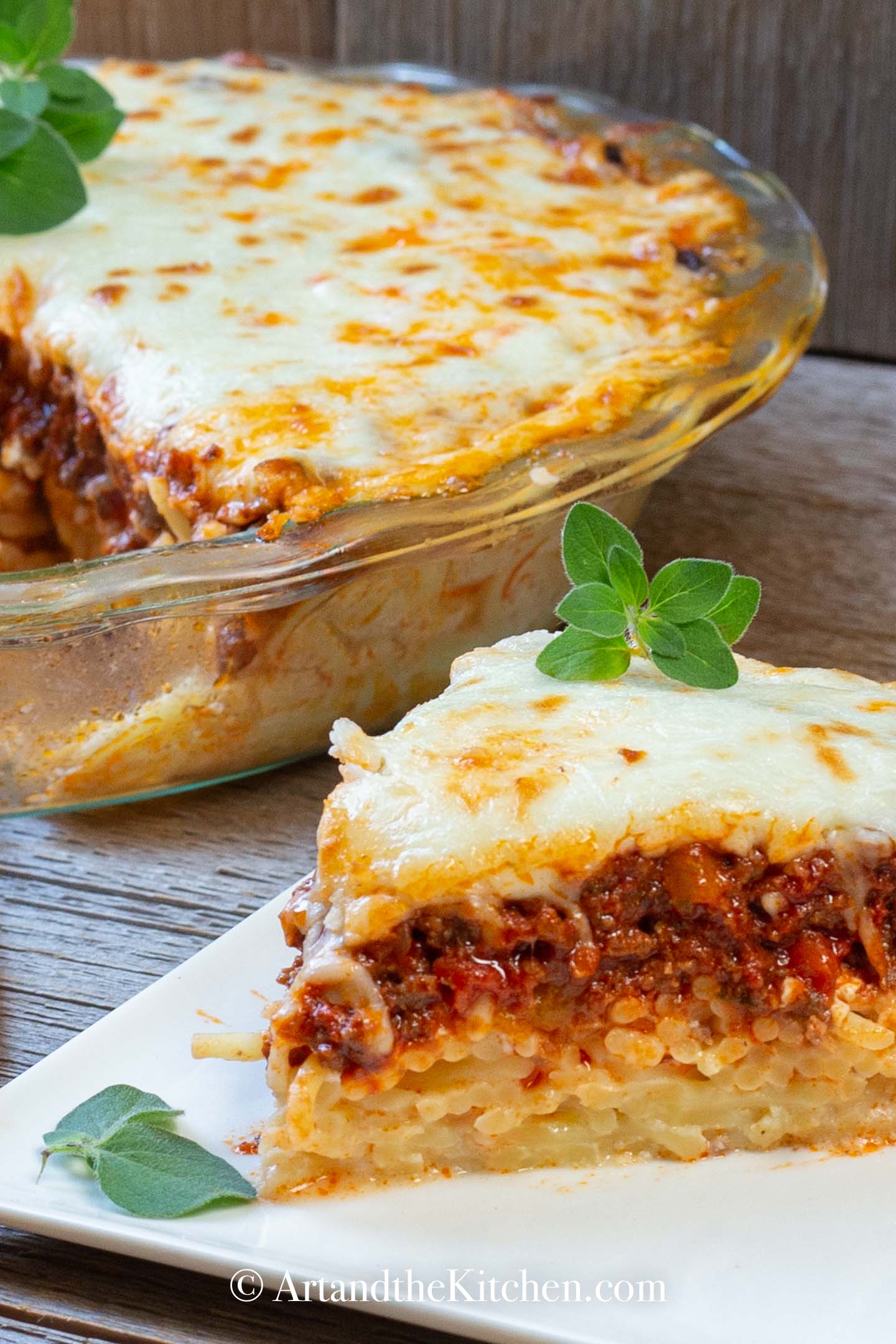 Dinner pie made with layers of spaghetti, meat sauce, topped with melted cheese.