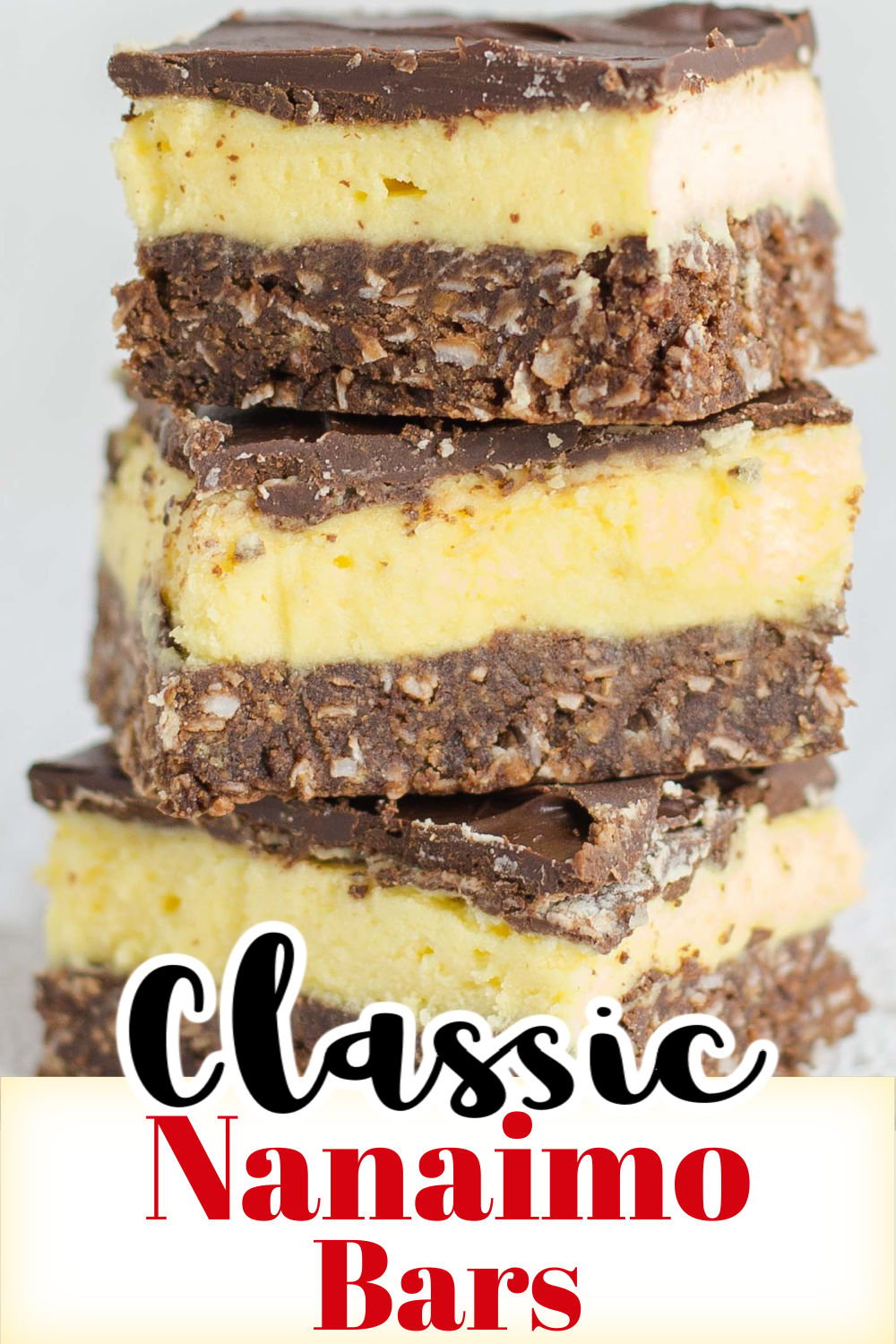 Stack of three bars with layers of chocolate coconut crumb crust, custard filling and chocolate coating.
