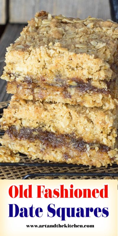A stack of two date squares on black cooling rack.