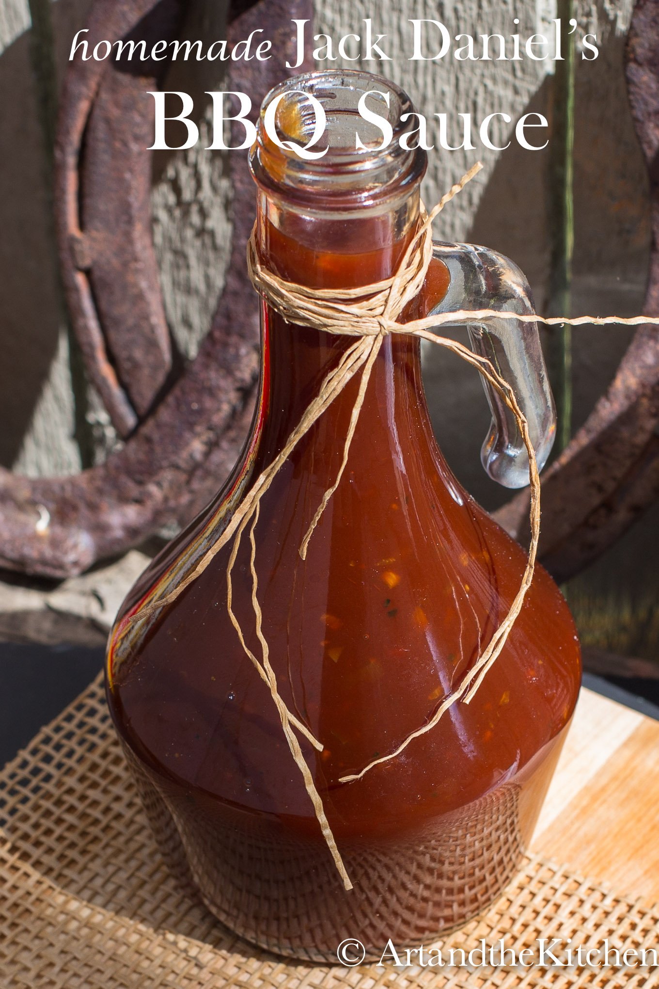 Decorative glass jar filled with homemade BBQ sauce.
