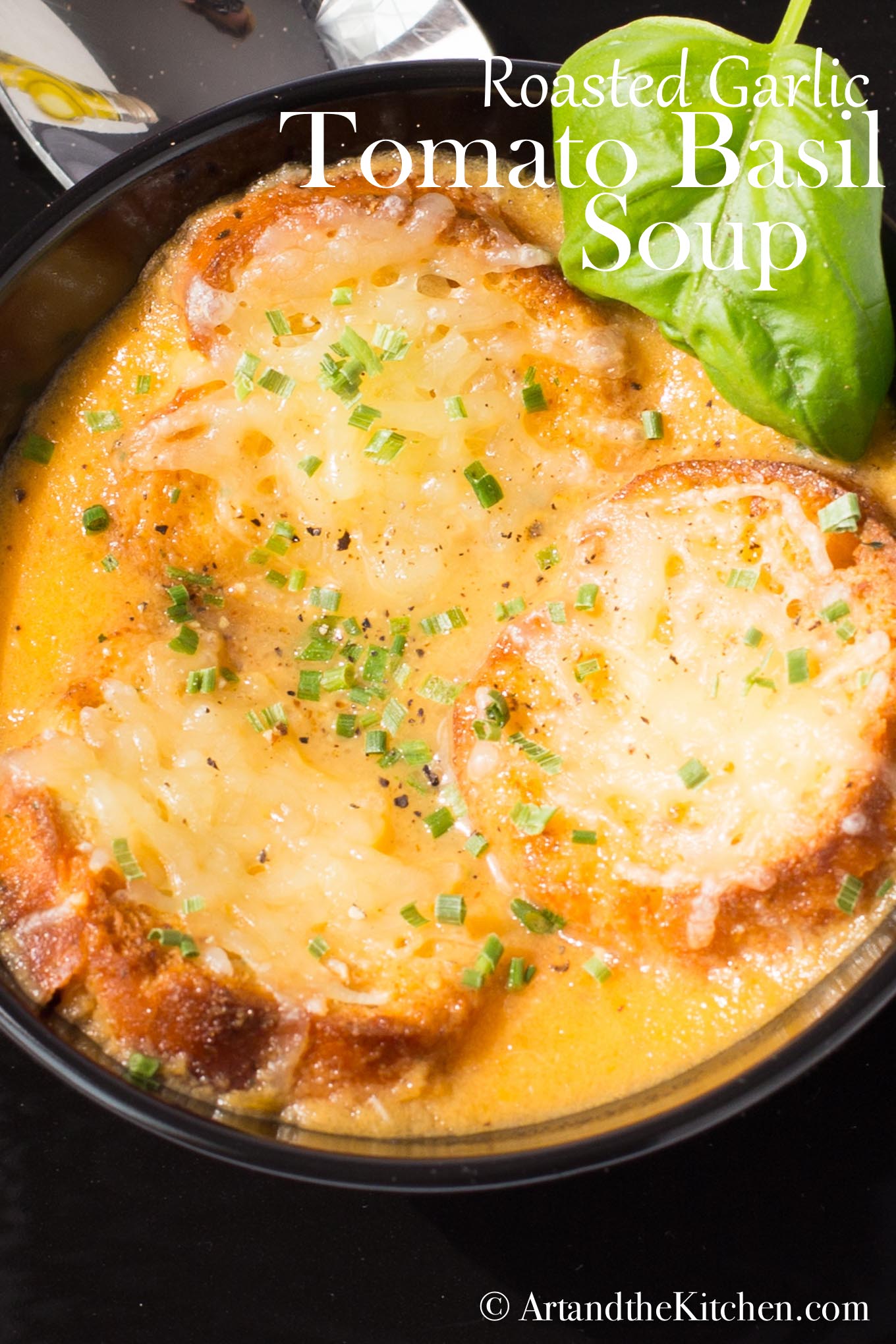 Tomato Soup with Roasted Garlic and Basil is super flavorful! It is made with roasted garlic, fresh basil and fresh, ripe tomatoes. via @artandthekitch