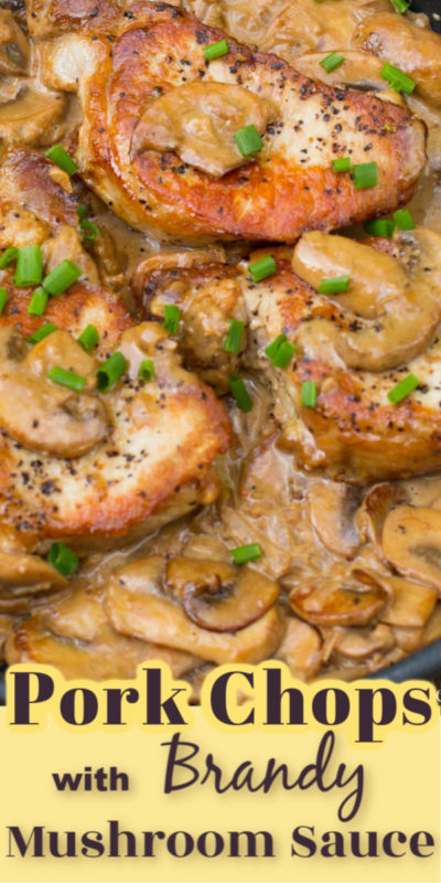 Cast iron frying pan with seared pork chops in a creamy mushroom sauce, garnished with green onion slices.
