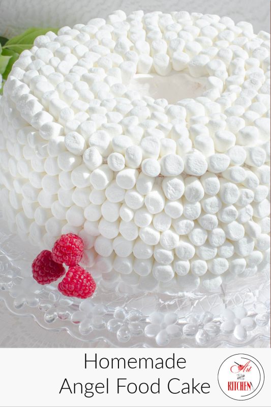 Angel food cake decorated with white miniature marshmallows.