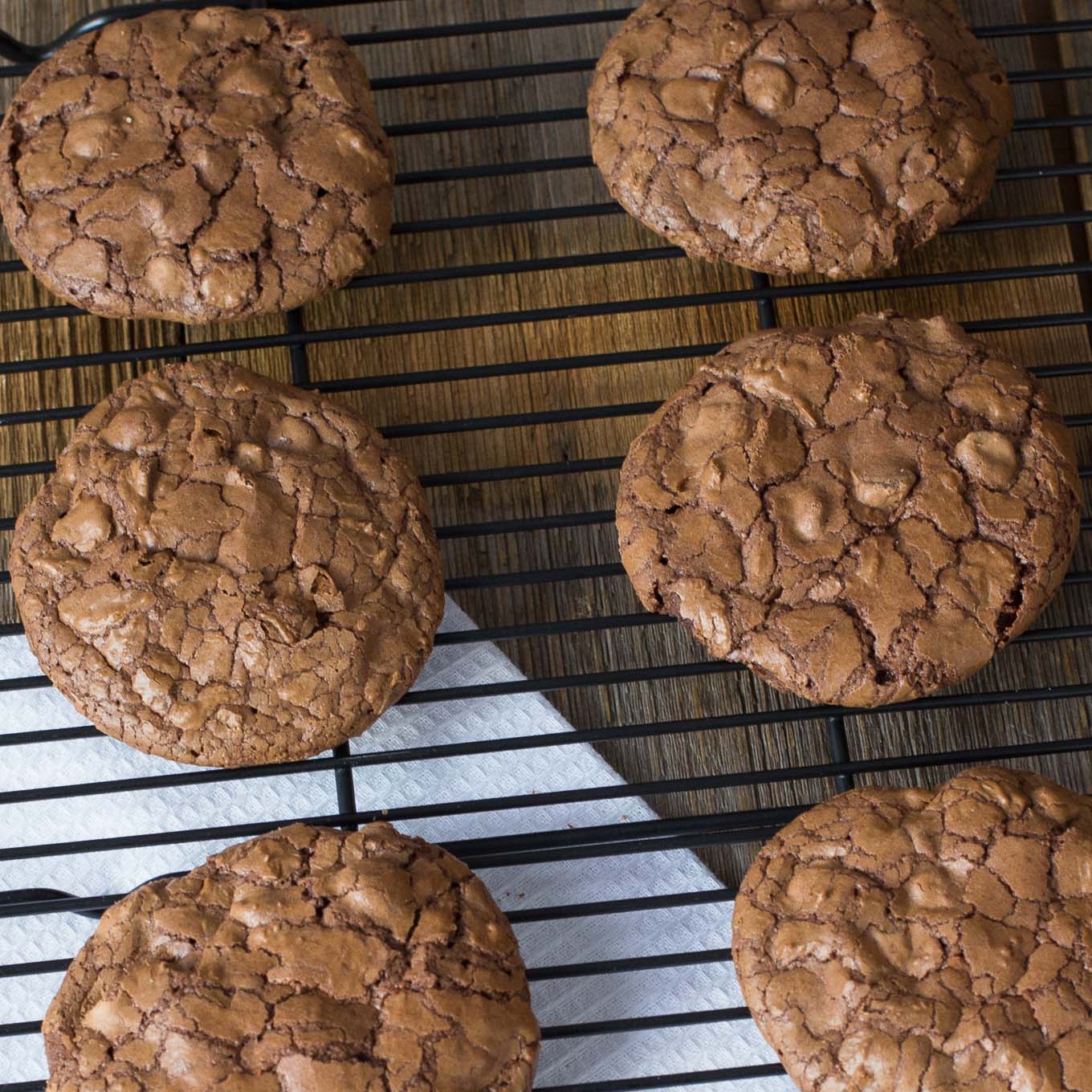 Cooling rack filled with chocolate cookies.