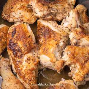 Cut up chicken pieces roasted golden brown.
