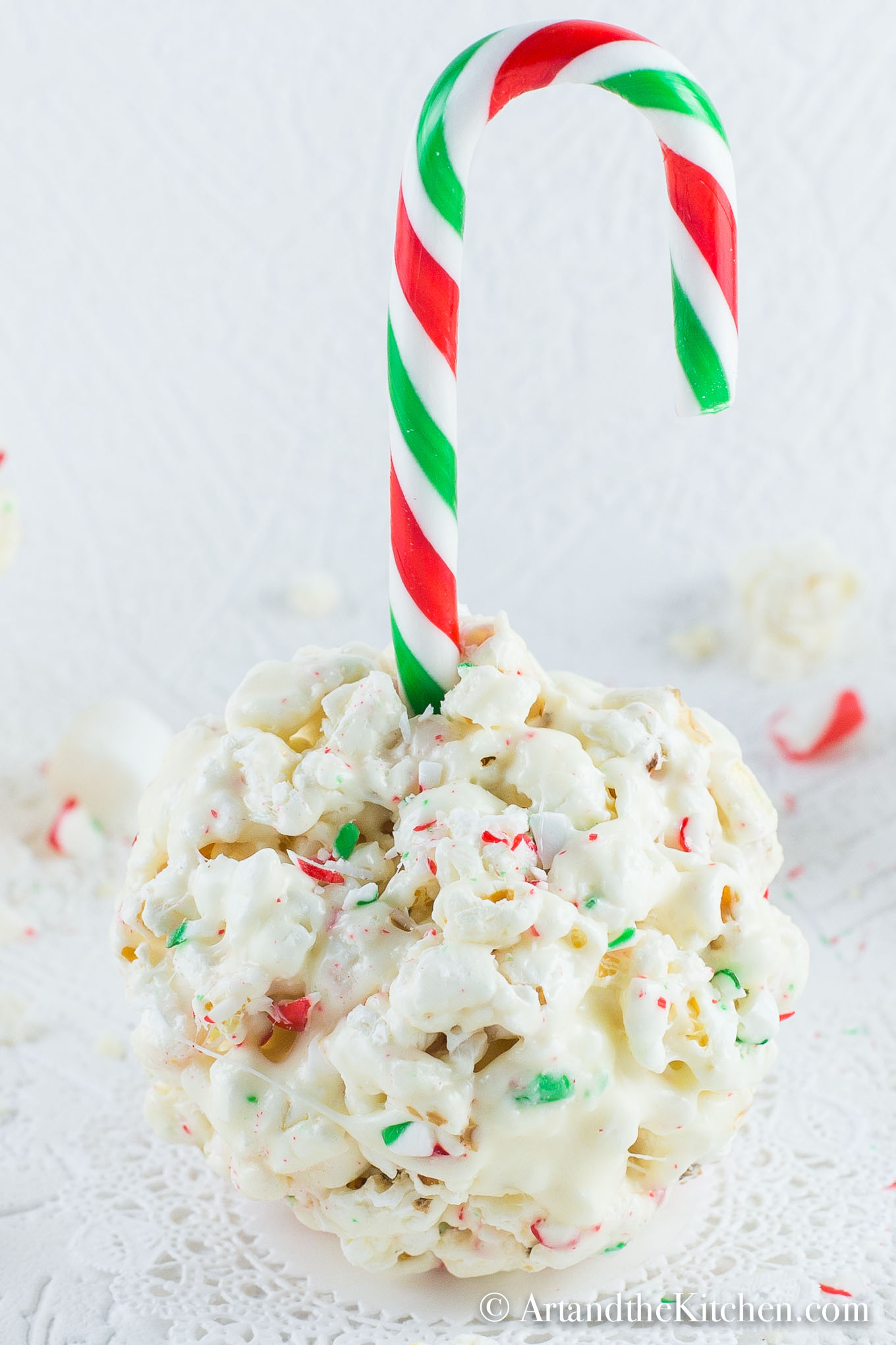 Popcorn balls of candy cane, white chocolate and marshmallows.  