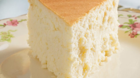 slice of creamy New York Cheesecake on a plate