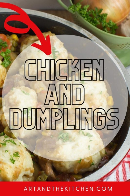 Roasting pan filled with chicken stew topped with fluffy dumplings.