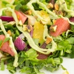 Tossed salad with artichokes, grapefruit, oranges, red onions and pistachios drizzled in avocado dressing.