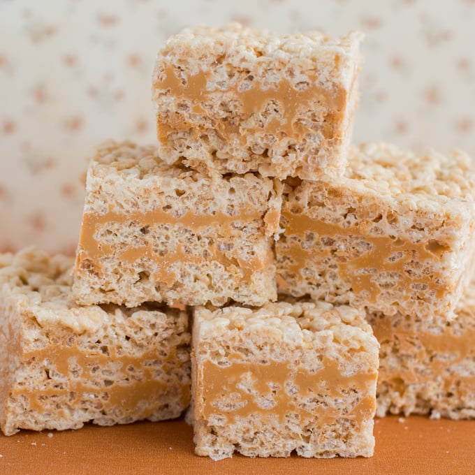 Stack of rice krispie squares with butterscotch layers.