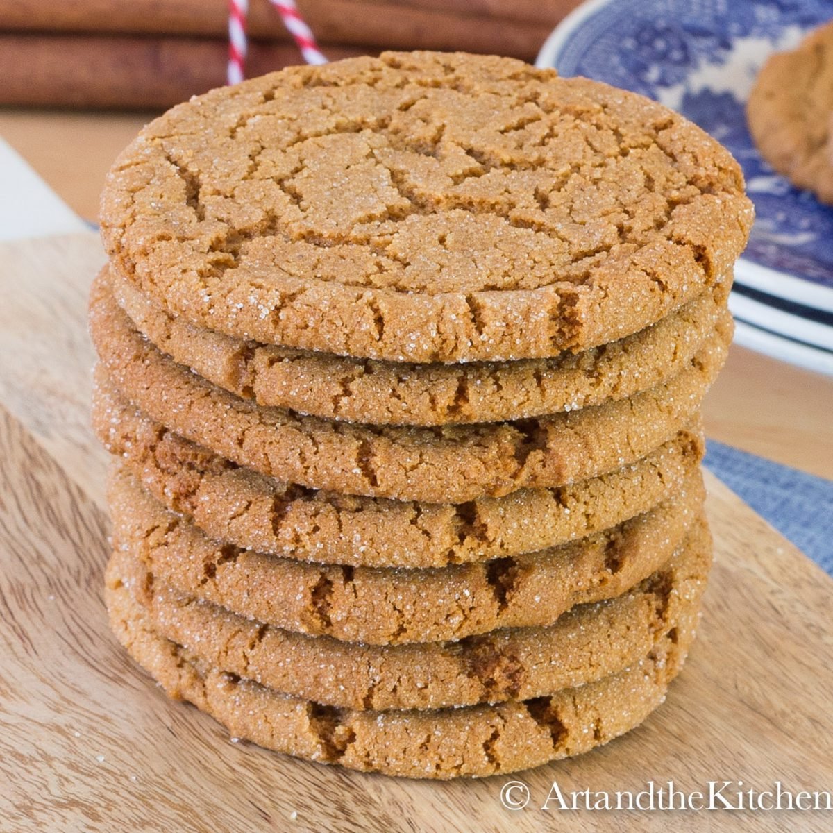 Stack of crispy ginger cookies on wood board