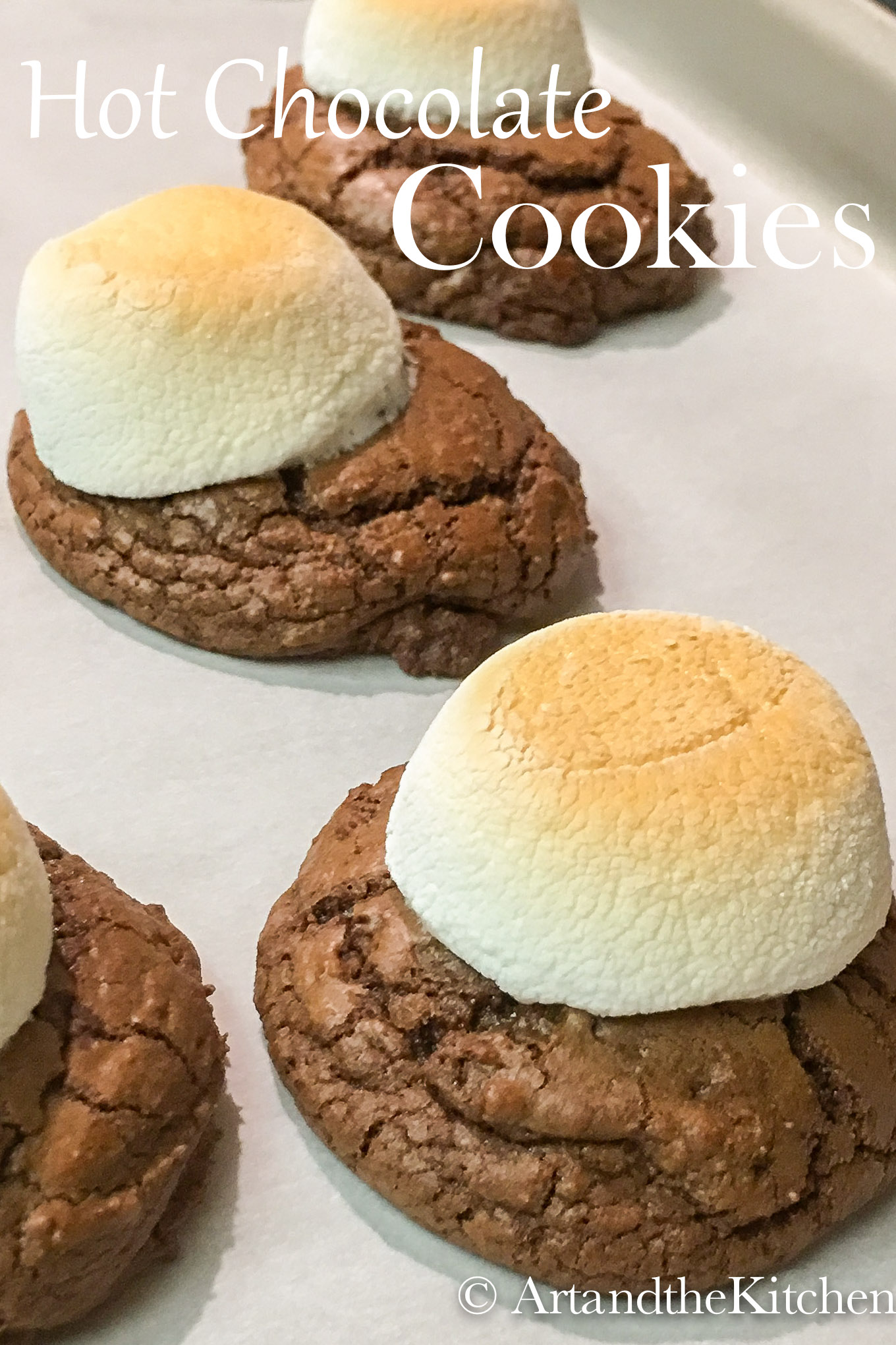 Hot Chocolate Cookies is a chocolate lover's dream cookie! Everyone will love these fantastic chocolate cookies topped with a toasted marshmallow. via @artandthekitch