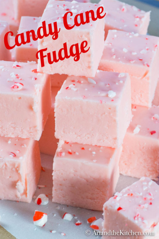 Stack of pink fudge made with candy canes.