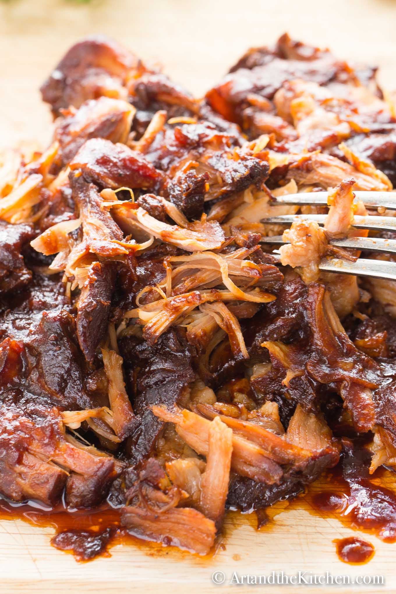 Shredded pulled pork coated in barbecue sauce.