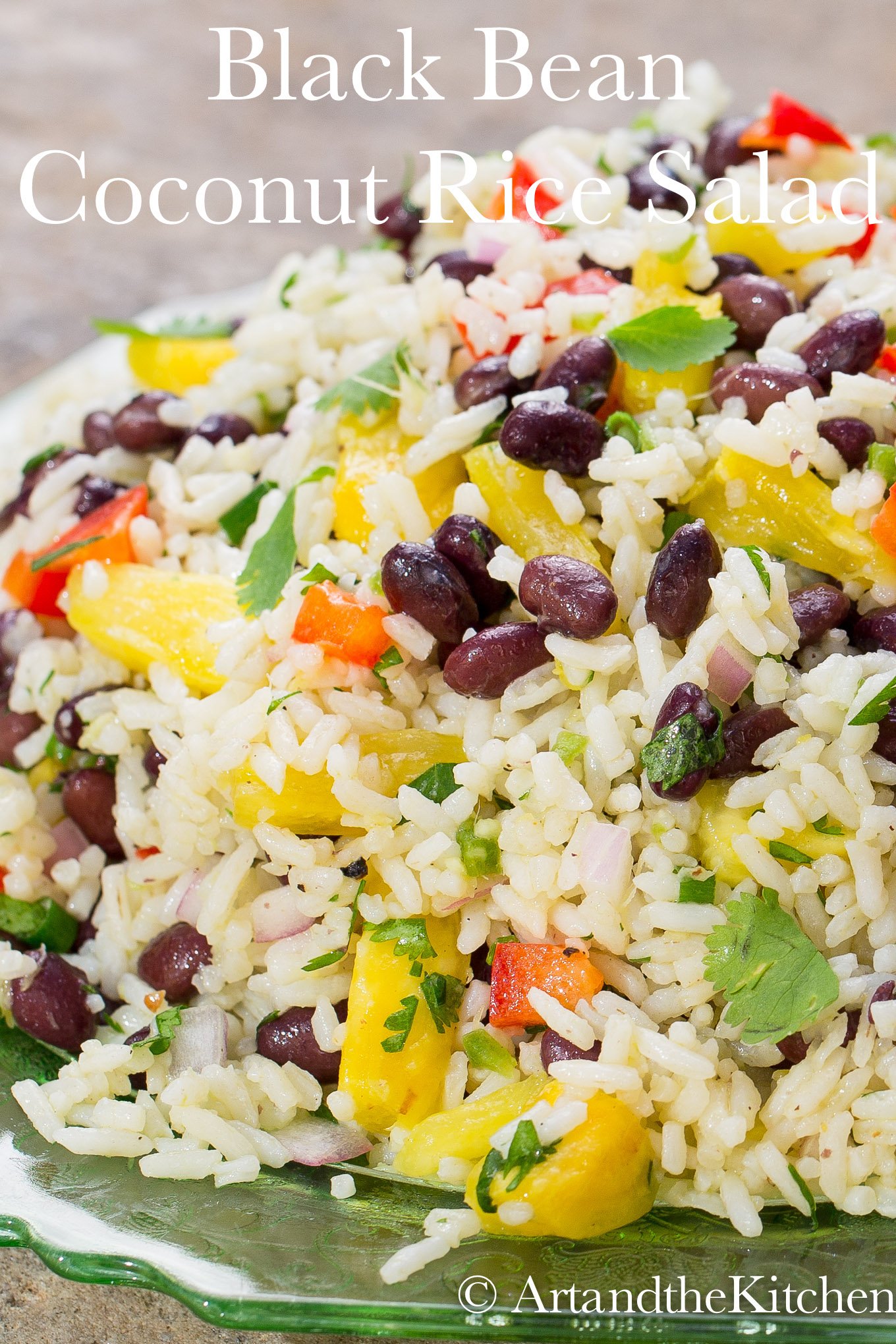 Black Bean Coconut Rice Salad is a colorful, zesty salad with a delicious combination of ingredients like coconut-infused rice, beans, bell peppers, red onion, and pineapple. via @artandthekitch