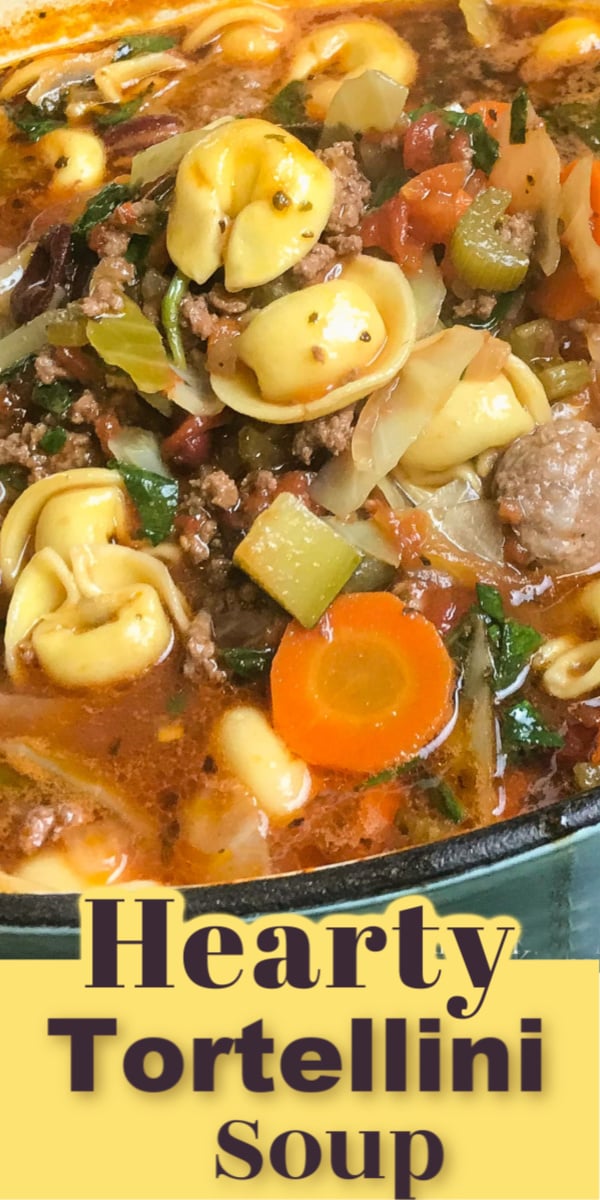 Hearty Tortellini Soup is loaded with vegetables, ground beef, Italian sausage and tortellini and simmered in a rich and savoury tomato beef stock. Pure comfort food! via @artandthekitch