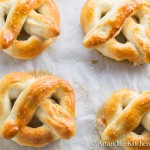 Freshly baked pretzels on parchment paper