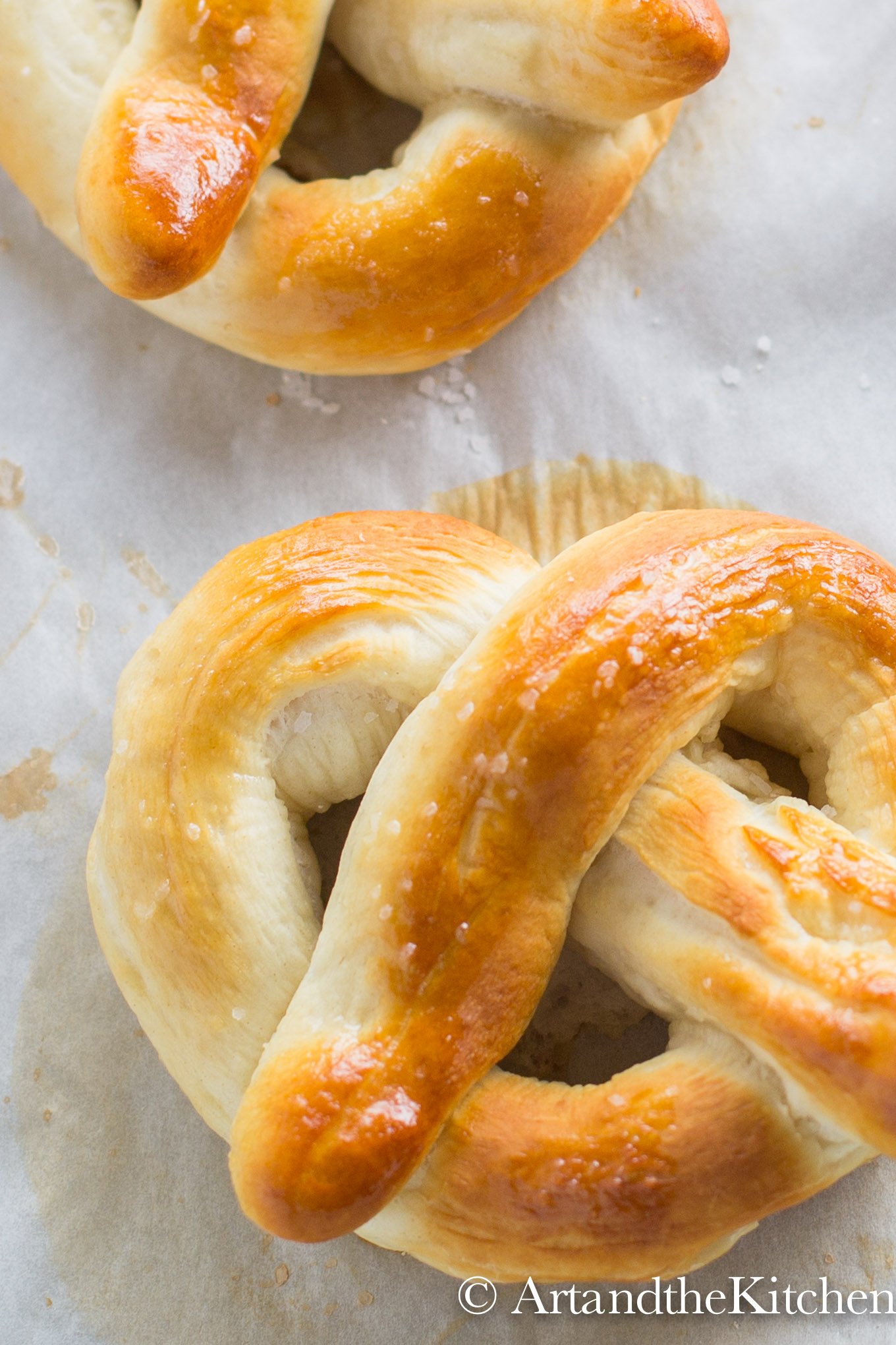 freshly baked pretzel on parchment paper