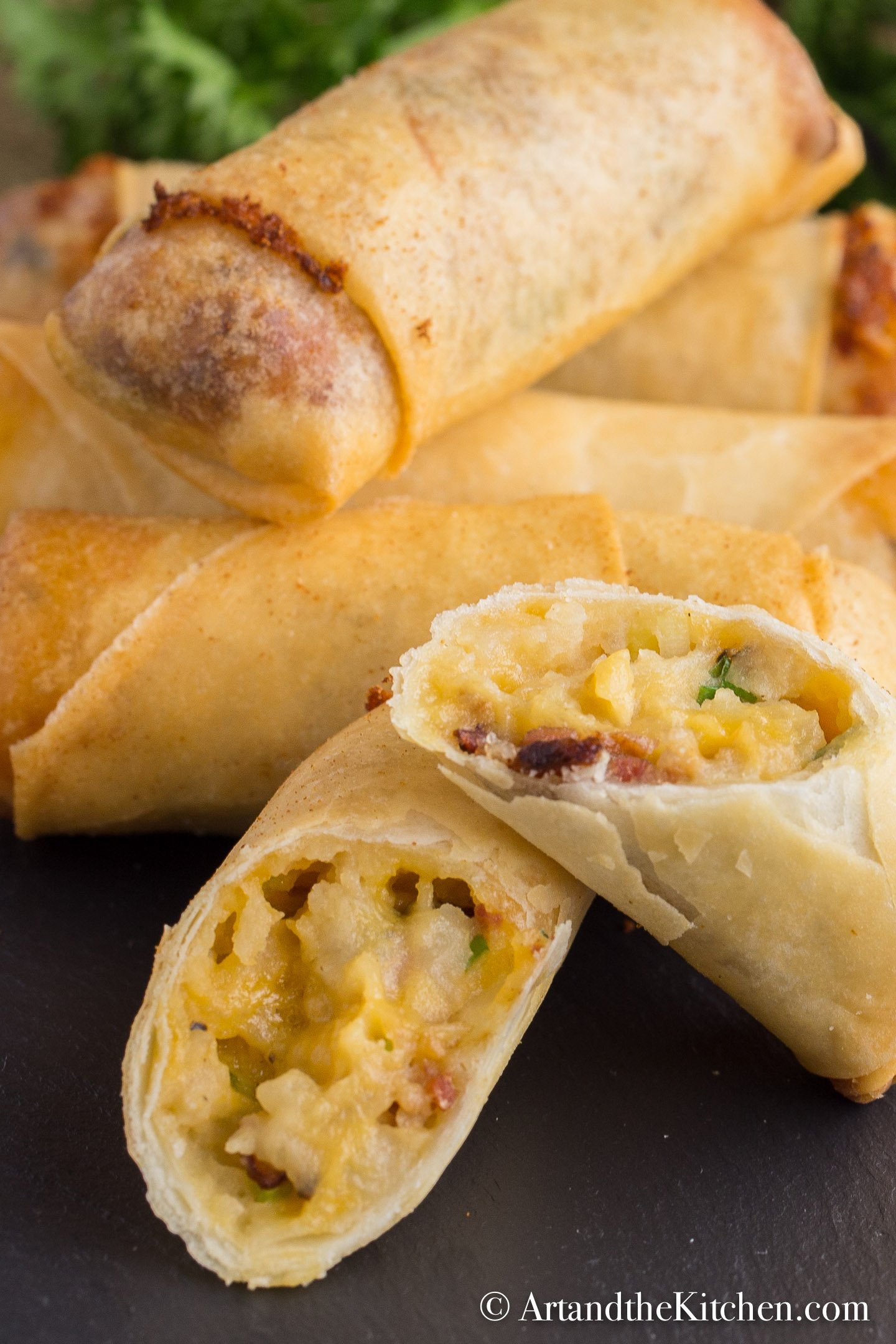Stack of spring rolls filled with a baked potato mixture.
