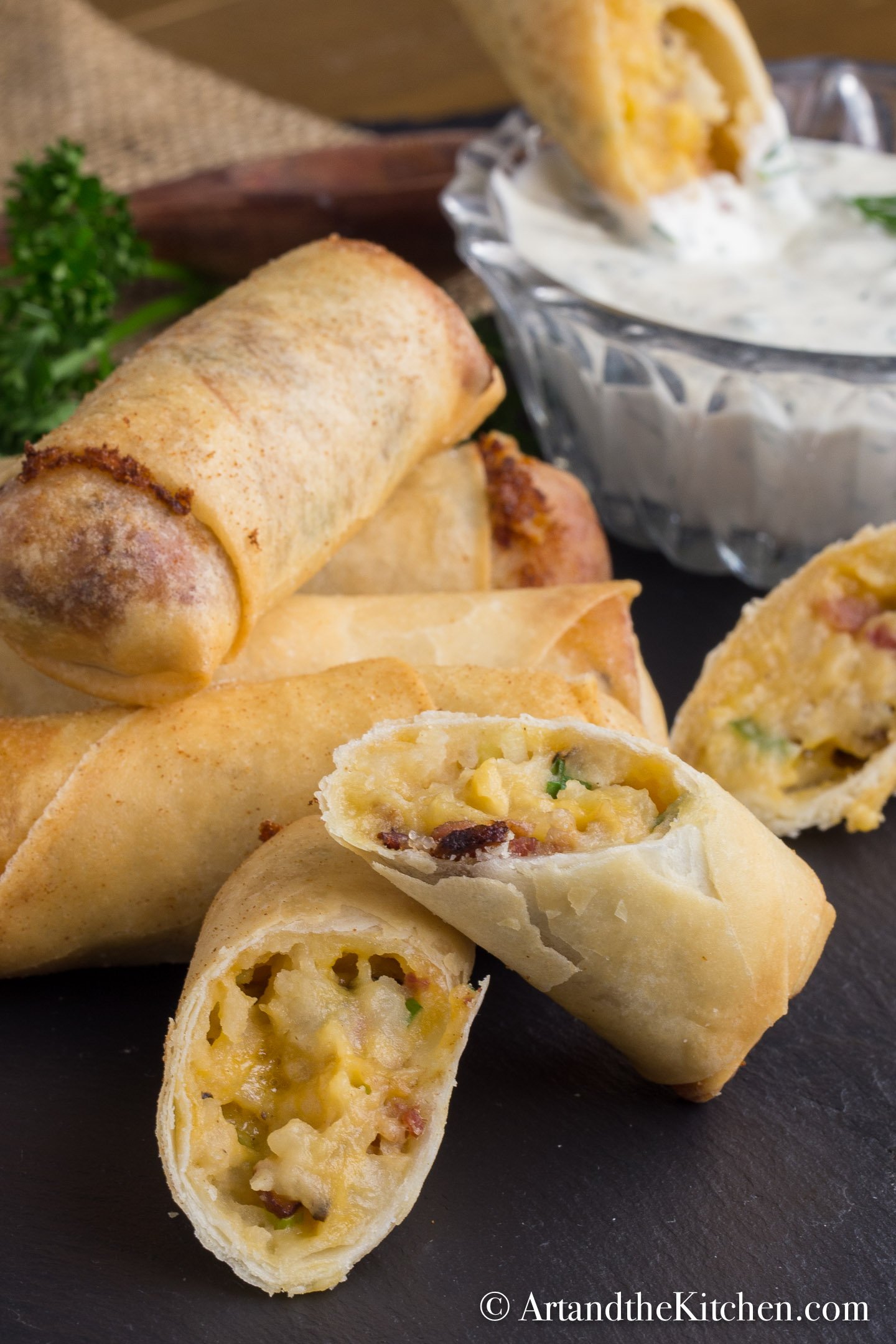 Stack of spring rolls filled with a baked potato mixture.