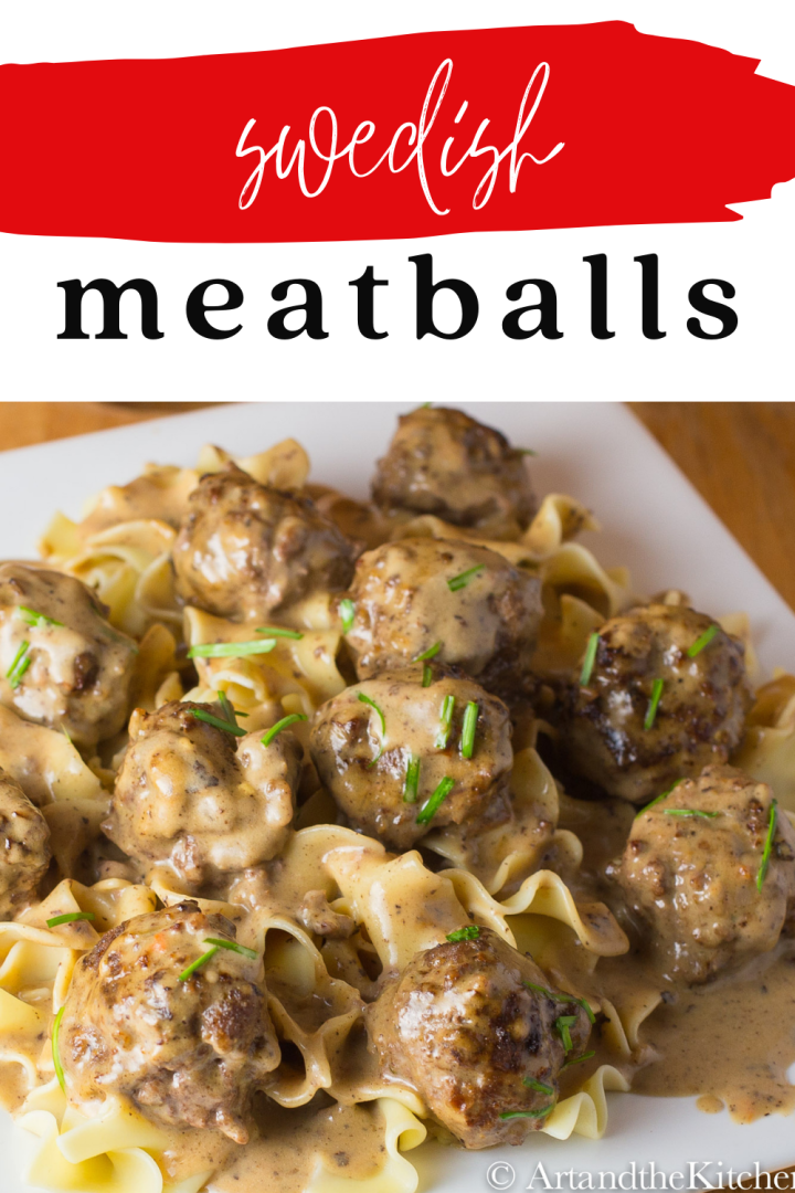 Plate of meatballs in a creamy sauce on top of broad noodles.