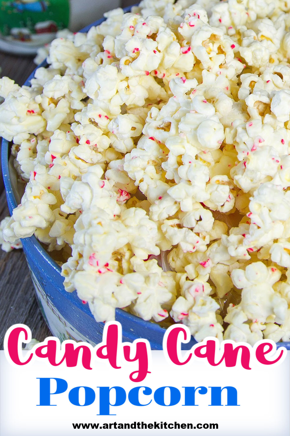 White Chocolate Candy Cane Popcorn is a must make holiday treat. It is so easy to make, popcorn coated in white chocolate and bits of candy cane. This addictive snack makes a great gourmet food gift. via @artandthekitch