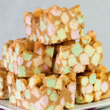 Stack of sweet squares made with colorful mini marshmallows, peanut butter and butterscotch chips.