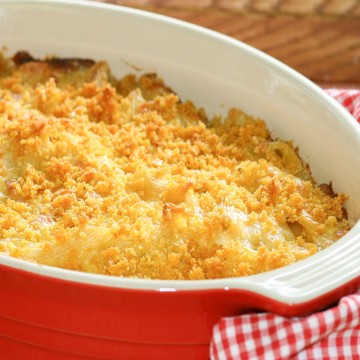 Tuna casserole topped with Panko crumb mix in red oval baking dish.